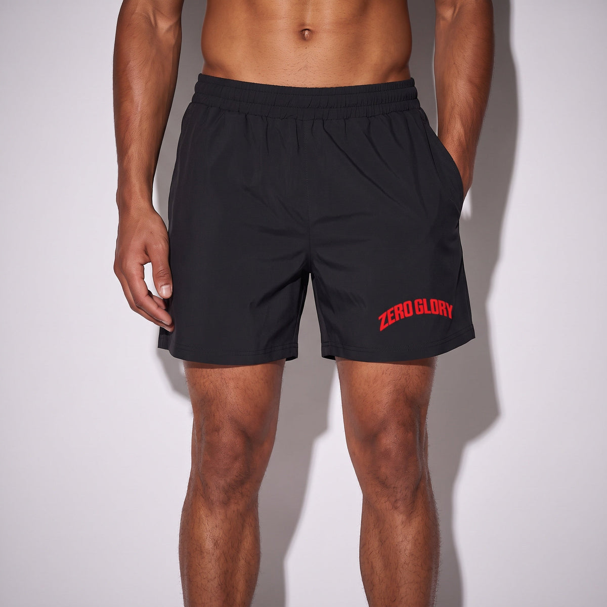 Performance gym shorts in black with red arched ZERO GLORY logo