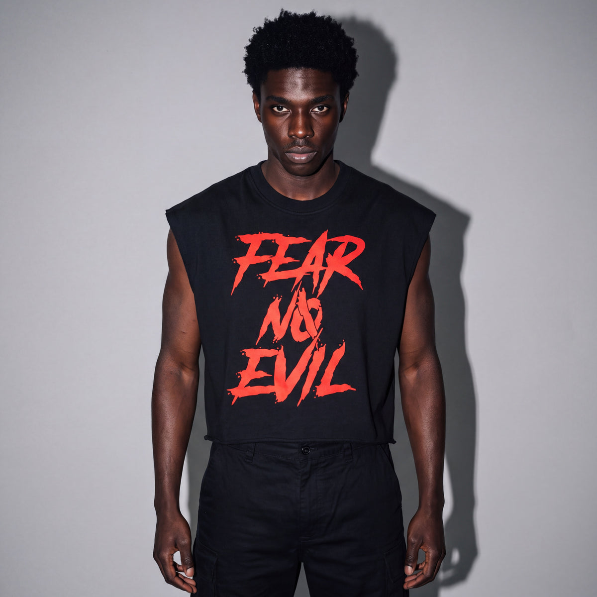 Boxy tank in black French terry with arched FEAR NO EVIL graphic