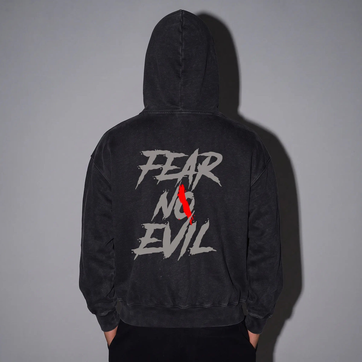 Overcast Heavyweight Oversized Hoodie featuring a bold 'FEAR NO EVIL' graphic on the back, showcasing streetwear style.