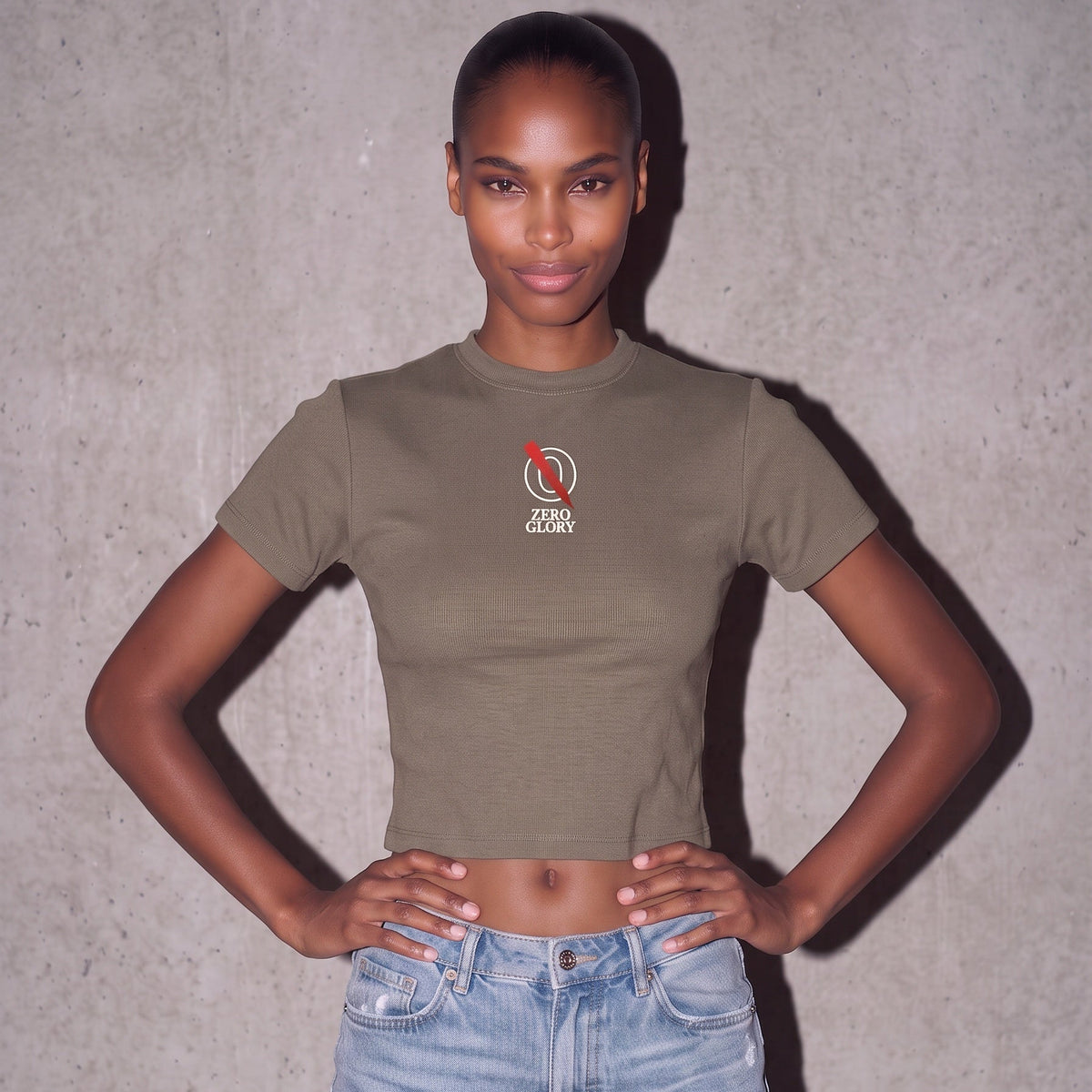 Model wearing women's chic mock tee in olive green, showcasing a soft stretch design and Zero Glory logo.