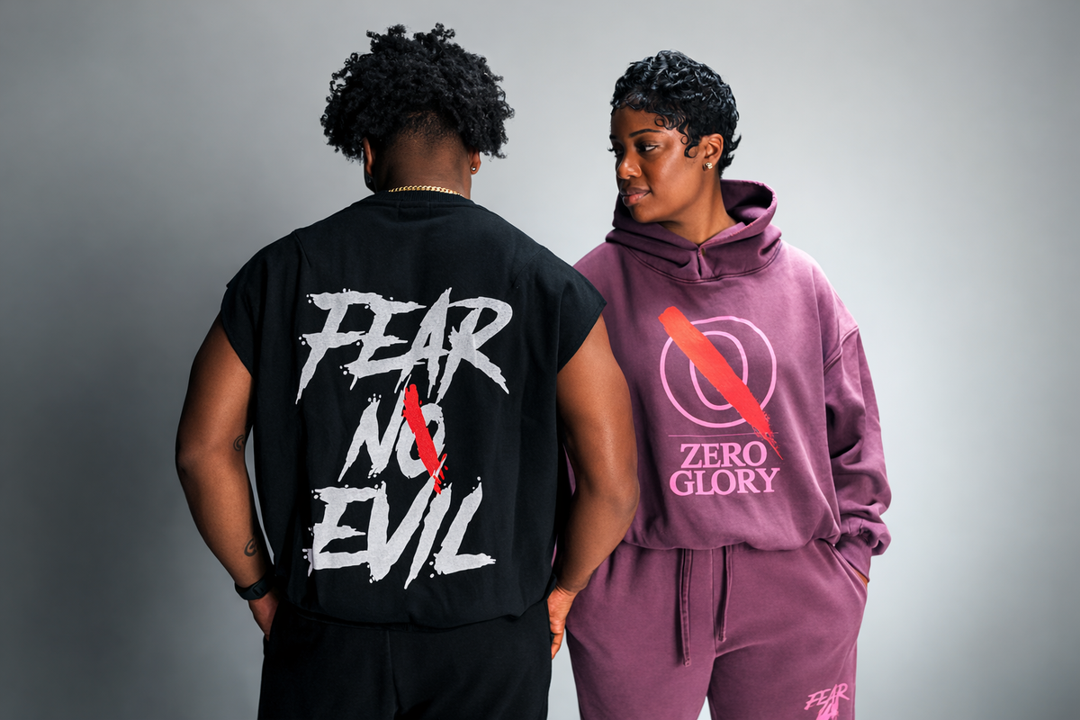 Models wearing Zero Glory Christian streetwear, including a purple hoodie and black Fear No Evil graphic T-shirt