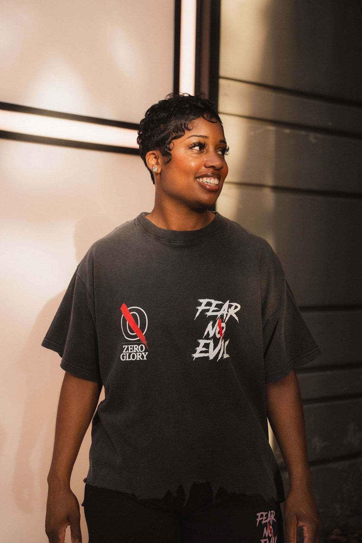 Zero Glory founder wearing a black Fear No Evil graphic T-shirt with the brand logo