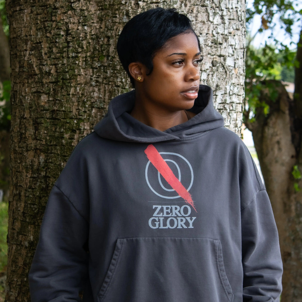 Woman wearing a Zero Glory hoodie, representing Christian streetwear for entrepreneurs.