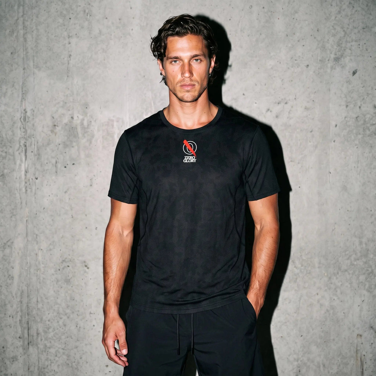 Athletic signature set — Man wearing a black Dominion Performance Athletic Tee, designed for comfort and fit during workouts and daily activities.