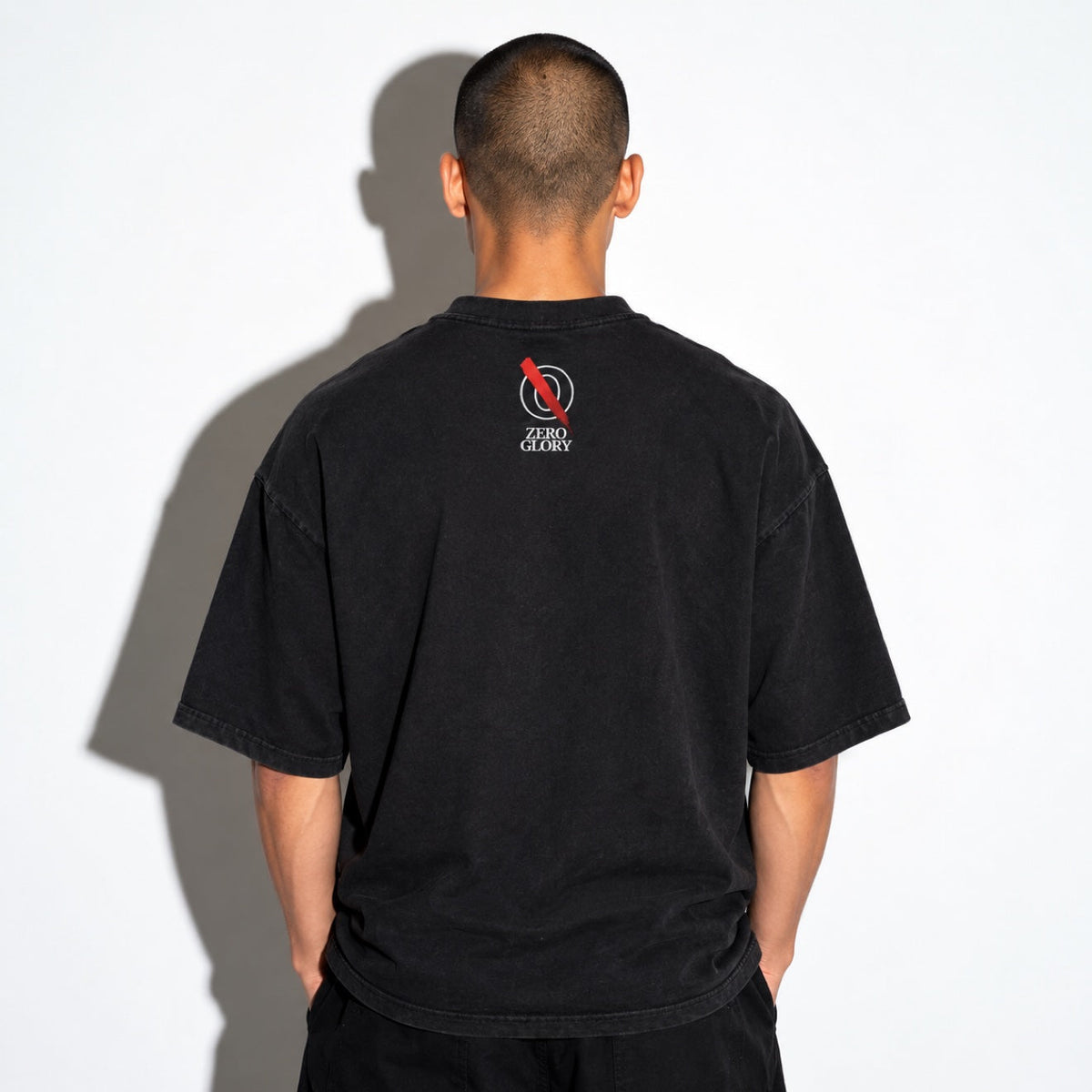 Model wearing the black boxy tee