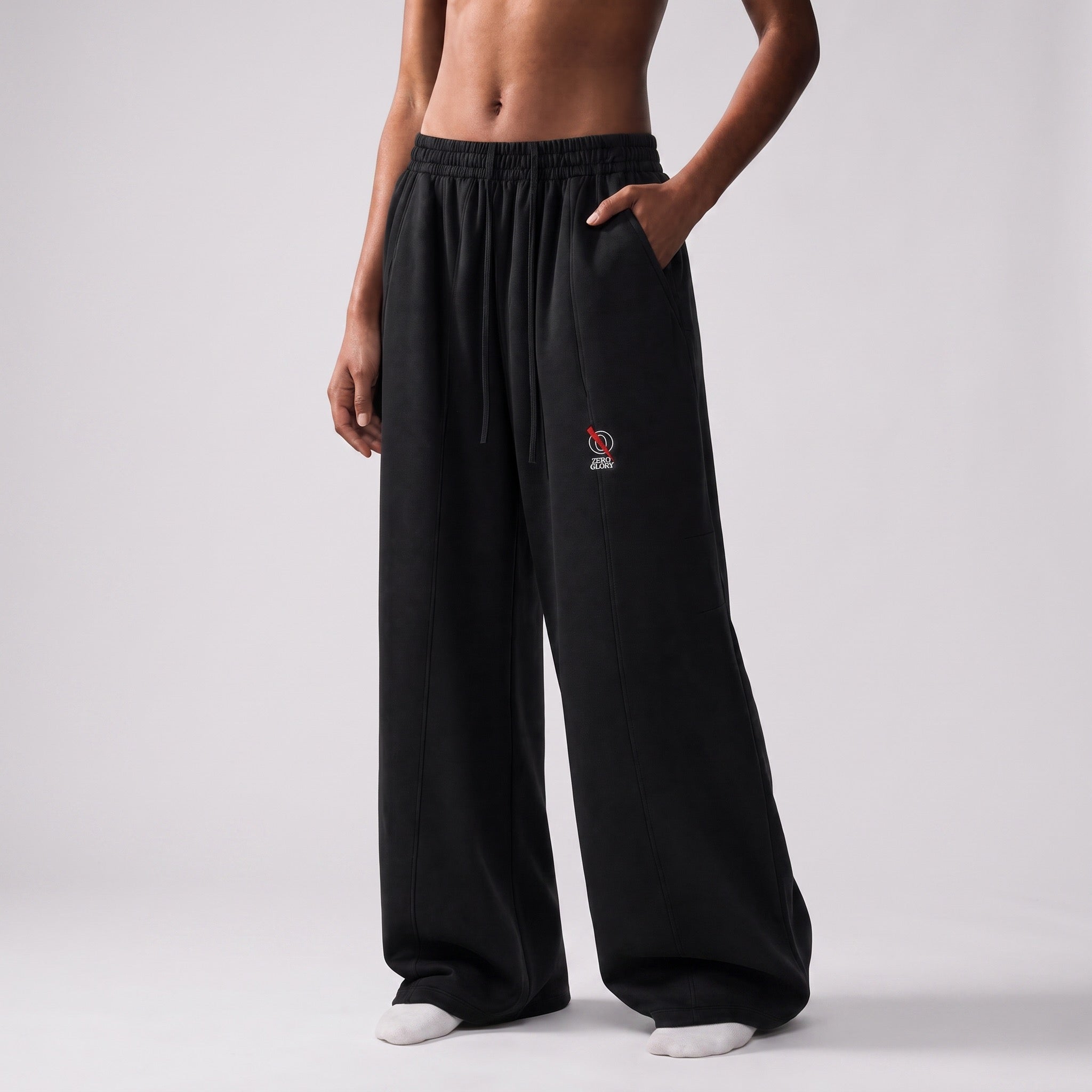 a model wearing premium palazzo wide leg pants in black with an elastic waistband and side pockets