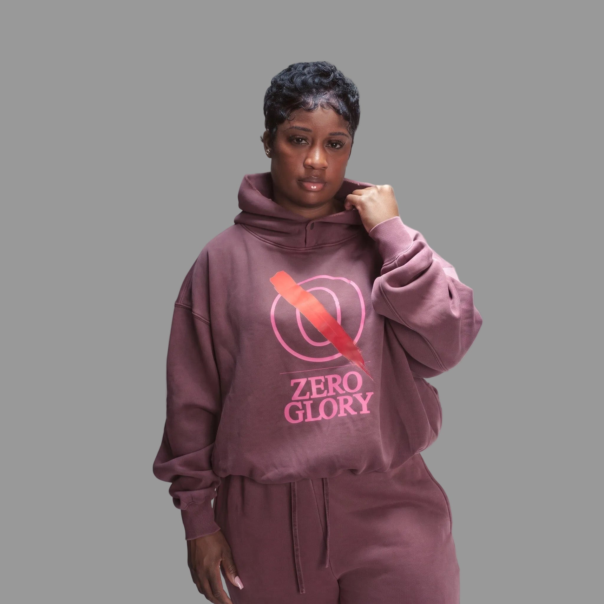 Pepto Hoodie by Zero Glory modeled by a woman in a stylish oversized fleece hoodie with a vintage wash.