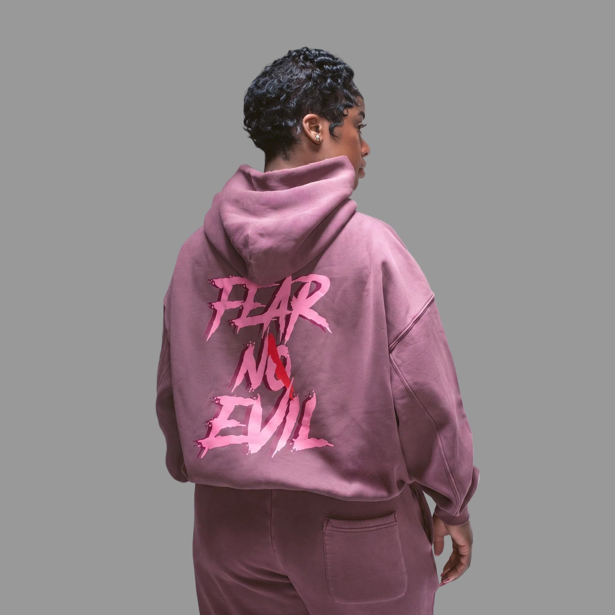Pepto Hoodie featuring a vintage washed finish and oversized fit, showcasing the 'FEAR NO EVIL' design on the back.