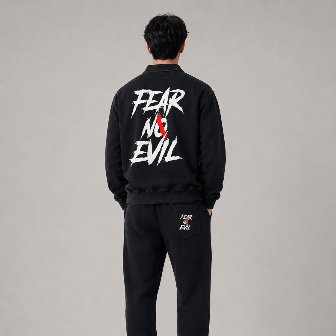 Collared sweatshirt for casual wear featuring bold graphic design on back with the text 'FEAR NO EVIL'.