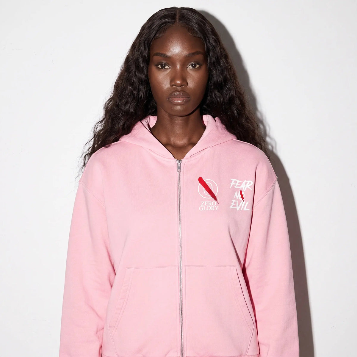 Model wearing the Zero Glory Pink Warrior Zip Hoodie, a Breast Cancer Awareness Zip Hoodie with a relaxed fit.