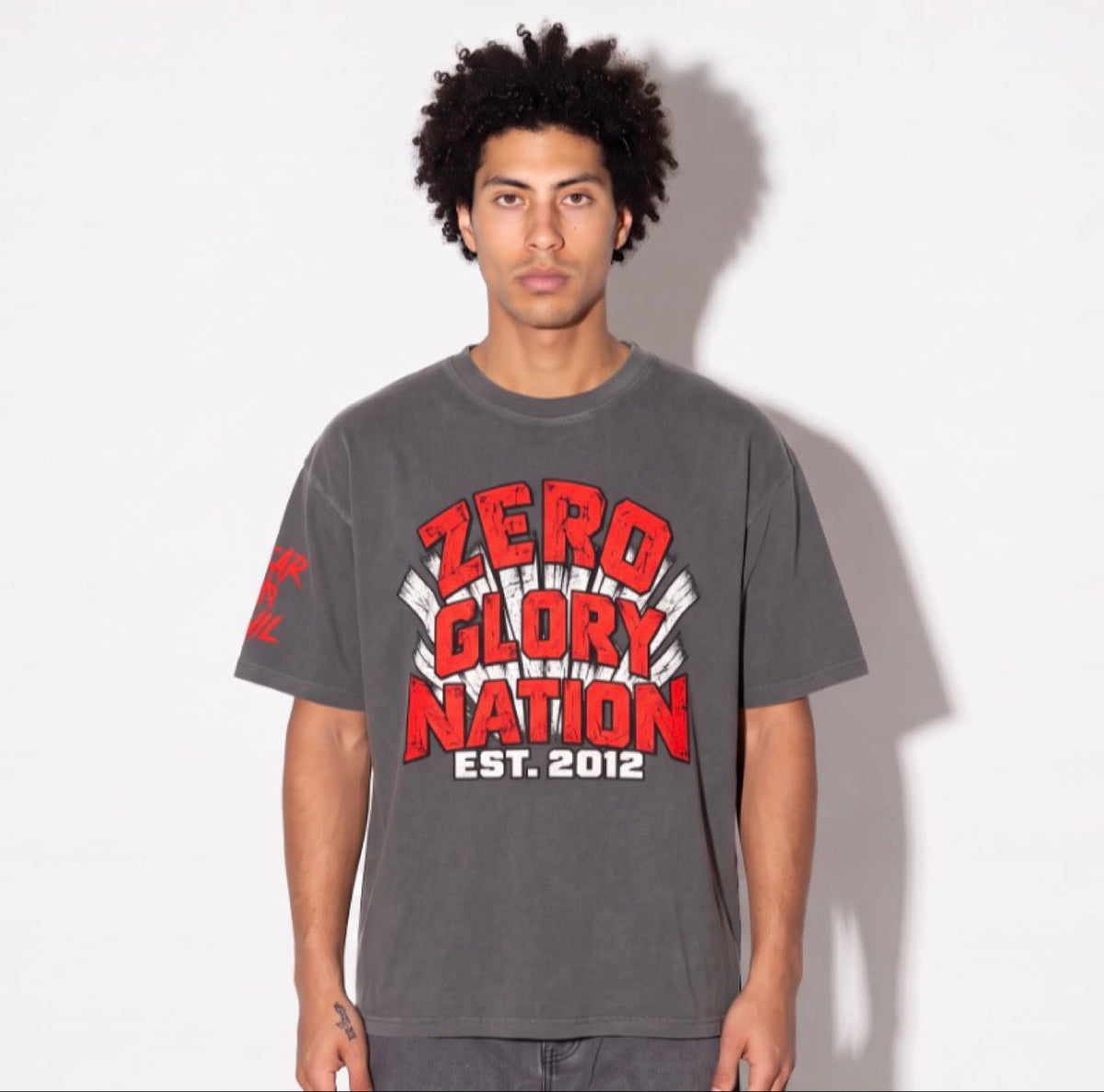 Close-up of Y2K graphic tee sleeve with FEAR NO EVIL print